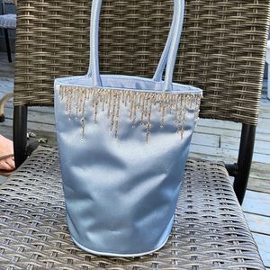 Satin beaded round bottom clutch draw string bag light blue